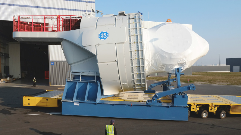 A giant GE wind turbine called the Haliade is leaving the St. Nazaire factory. The generator is located behid the hub, the pointy part up front. Photo: GE Renewable Energy